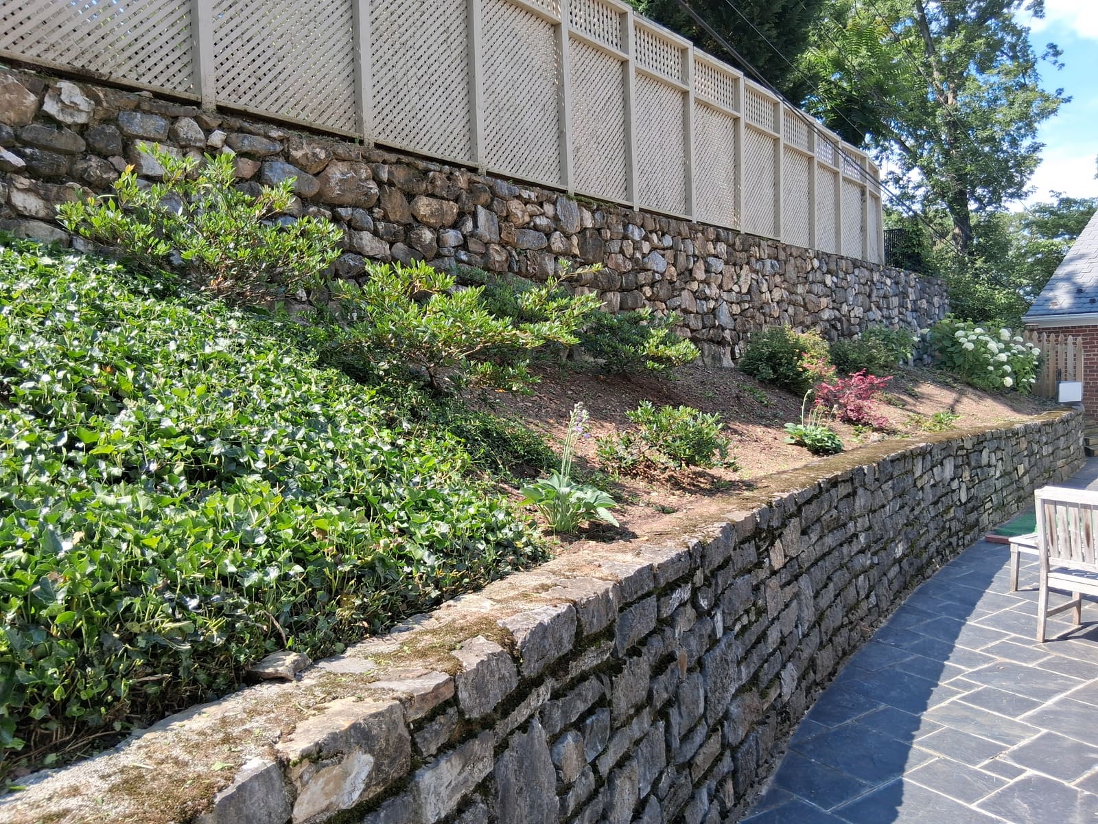 After — stone wall planting bed after RLD service